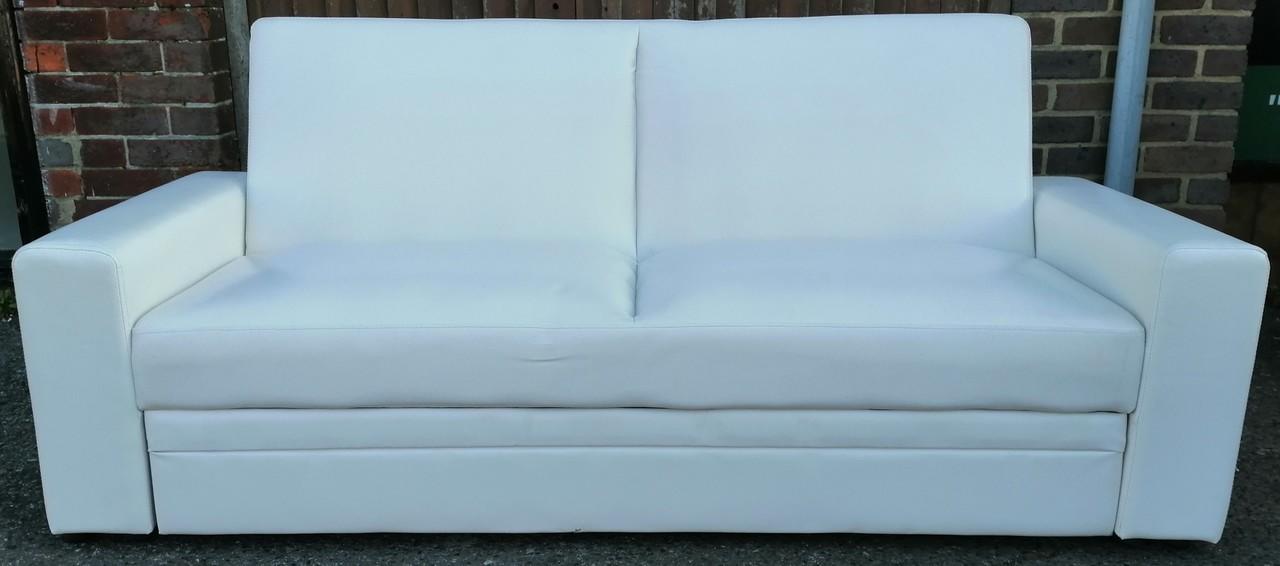 white faux leather click clack sofa bed