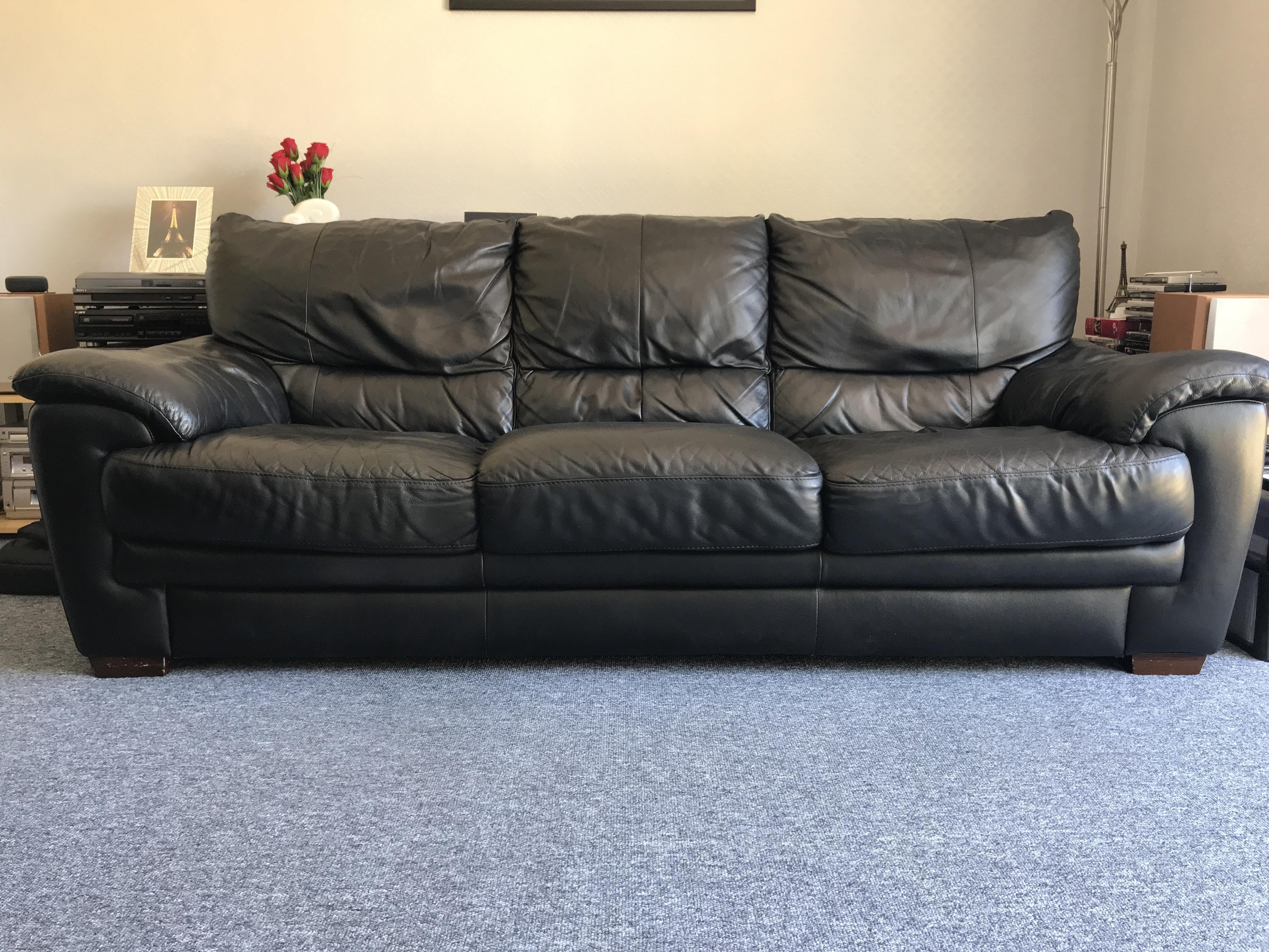 matching armchair with black leather sofa